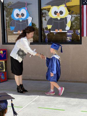 My daughter receiving her diploma from the wonderful Miss. Tess!!