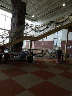 a rock climbing wall in the lobby