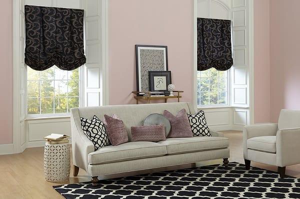 The black background of the fabric used in this Casual Soft Roman Shades is accented by metallic embroidered pattern.