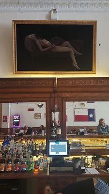 every texas saloon needs a black velvet nude over the bar.