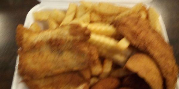 4 PC fish lunch special with fries and hush puppies-$6.99+ tax