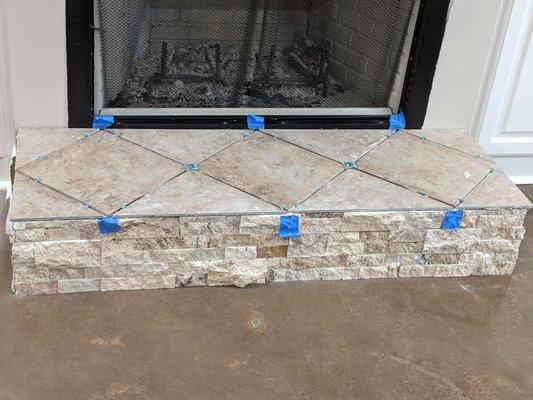 A small fireplace tile job . . .