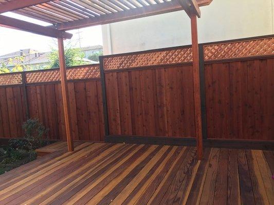 Stained deck, pergola, and fence with lattice