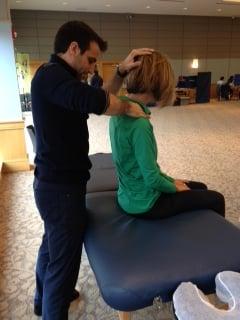 Dr. Rob Fenton, chiropractor and soft tissue specialist, performs Active Release Technique at an event