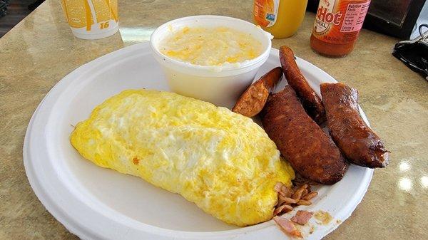 Ham & Cheese Omelet with grits and a Side of Spicy Smoked Sausage