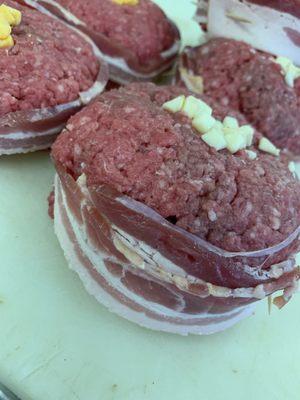 Bacon wrapped stuffed Juicy Lucy Burgers.