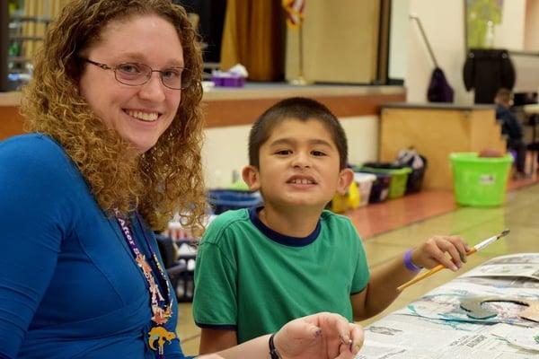 One of our amazing staff working with our students on the wild west art project.