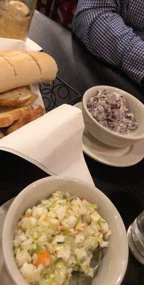 Rolls, two salads of coke slaw and a bean salad.