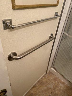 Grab bar installed low to assist with getting off toilet.