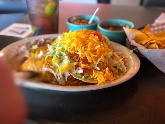 Wonderful Tex-Mex plate with chalupa, enchilada, taco, rice and beans. It's a lot of food and enough for two meals!