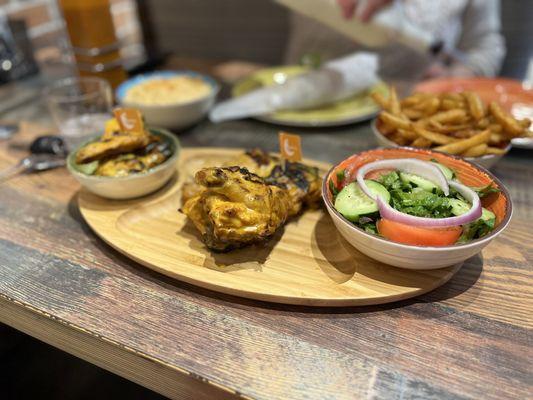 Medium half chicken with the house salad and peri peri fries