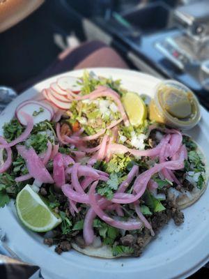 $13.00 for 4 carne asada tacos fully loaded with cilantro ,double tortilla, radish, pickled red onion,salsa Verde, and lime Dam good