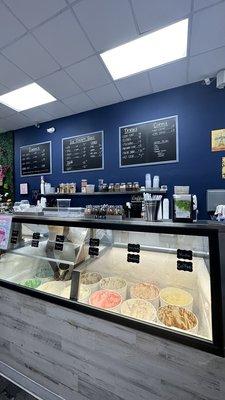 Inside view of ice cream, toppings and menus