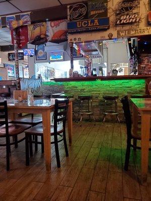 Bar stool seating and neon lights for all the local teams.