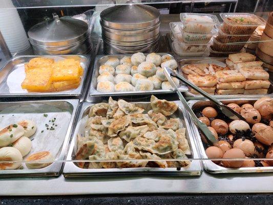 Dumplings, dimsum items, buns, tea eggs, pan fried taro cake