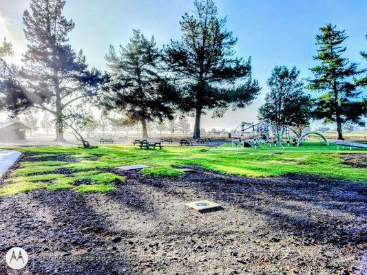 A cool morning mist at the children's playground, available for public enjoyment.