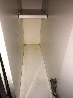 Cabinet that wasn't cleaned in the kitchen.