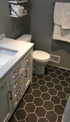 Increase the value of your home with an eye-catching bathroom tile. This trendy honeycomb design gives the bathroom an instant uplift.