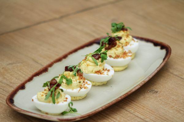 Deviled Eggs with Maple-Bourbon Bacon Shallot Crumble.