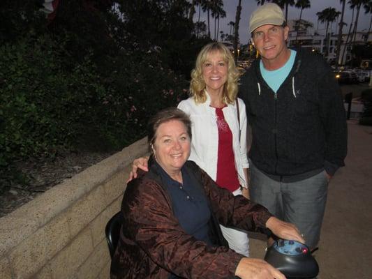 Me (sitting) with friends Catherine Robinson) as it gets dark enough to view Fireworks at Park Semper Fi located on a bluff above the pier.