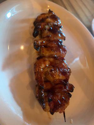 Killer shrimp!  Wrapper in bacon and grilled with a yummy sauce.