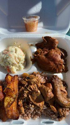 Stewed chicken with rice and beans, plantains & potato salad