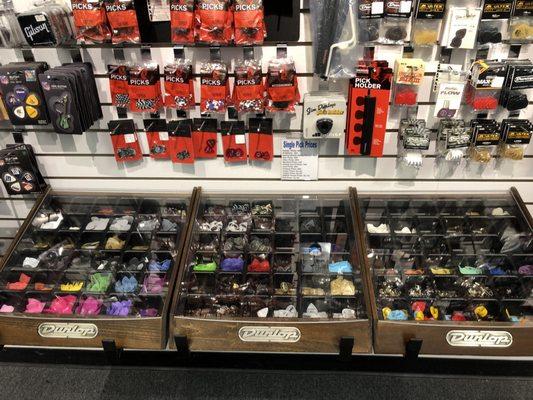 You can pick up and feel picks, unlike Guitar Center. Dietze is a better store all around and support local!