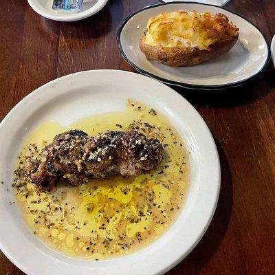 Sautéed beef tips and a twice baked potato