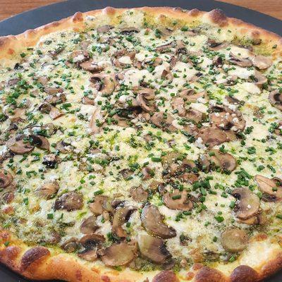 Genoa Pizza Special: Basil Pesto, Whole Milk Mozzarella, Gorgonzola Cheese, Sliced Mushroom, Fresh Minced Chive.