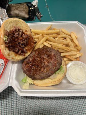 A bbq bacon burger with a side of fries