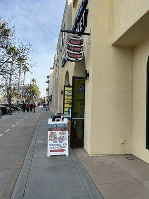 Front of store as you approach from the west