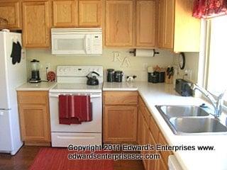 Kitchen Remodel By Edward's Enterprise. We removed and installed new cabinets, counters, sink, lighting, faucet, floor, paint