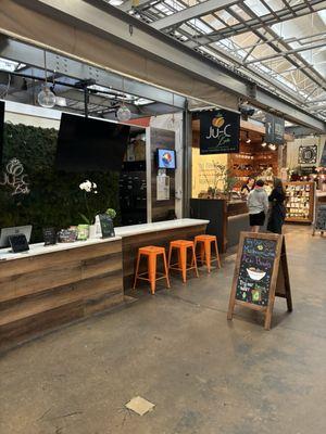 Cute and inviting set up. The owner could take those orange stools away when she closes during business hours.