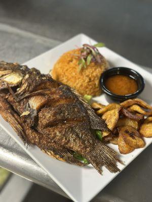 Fried Fish meal with sweet Plantains and Jollof Rice. Side special Sauce