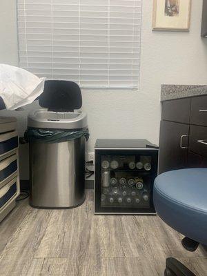 Doctor has a mini  refrigerator offering his patients drinks - soda, coconut juice or Starbucks coffee