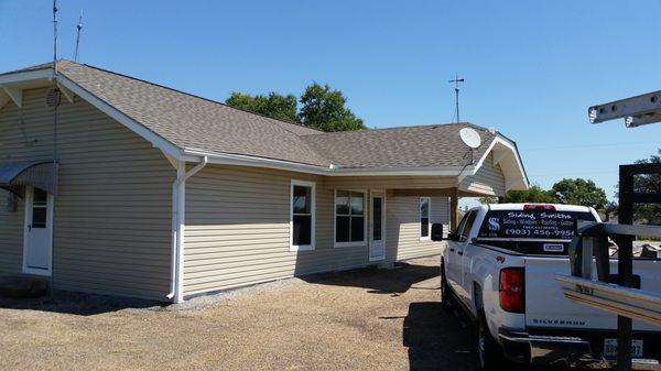 Vinyl siding and gutters.