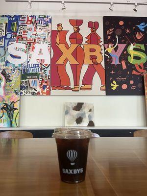 Cold Brew and wall of art