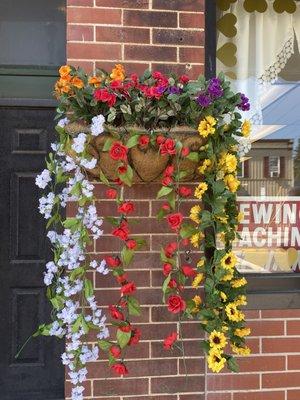 Stephanie's dad helped by bringing flowers to the front of the shop!