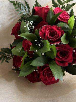 A dozen red roses wrapped