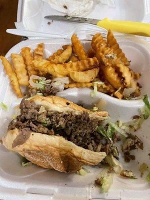 Philly Cheesesteak with fries. Deliciously prepared on a fresh roll with perfectly seasoned steak.