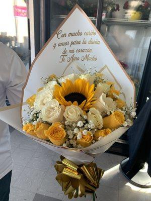 Luxury hand bouquet.... White roses, yellow roses, sunflower and some baby's breath. With a personalized message.