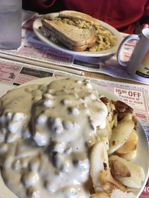 country eggs in the background, sausage gravy and biscuits in the foreground