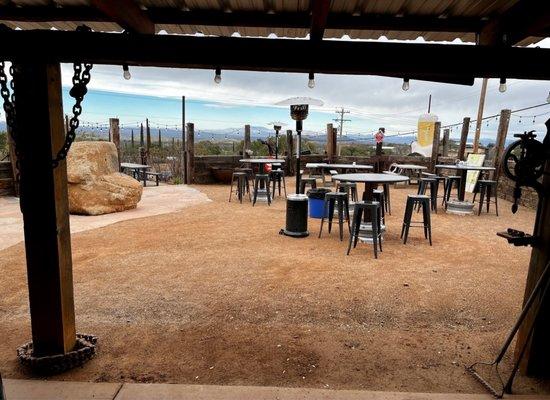 Outdoor seating with desert and mountain views.