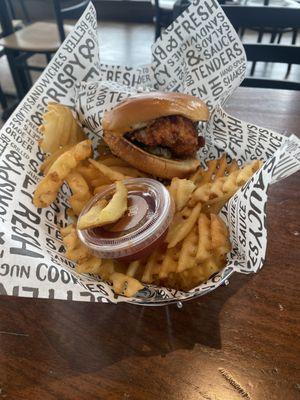 Spicy classic chicken sandwich and waffle fries.