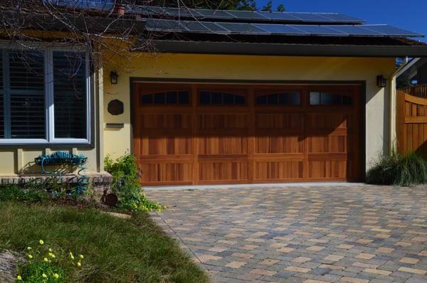 Awesome new steel garage door painted to look like wood.