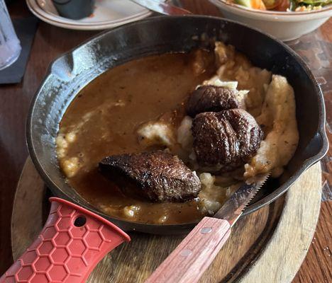 This is the $20 plate of food that we were served minus a bite of mashed potatoes and one beef tip.