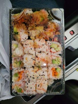 3 orders of Shushi jammed in to one container