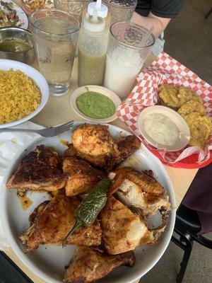 Whole Chicken half not spicy half spicy with rice and tostones.