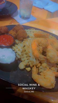 I had the Fried Jumbo Shrimp with Waffle Fries and Hush Puppies and it was delicious!