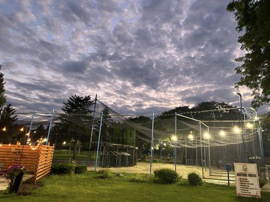 Cute outside sitting area & batting cages